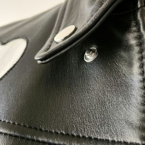 The Women’s Black Leather Jacket With Heart is made genuine leather. T 36